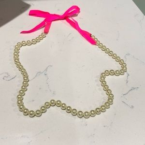 JCrew faux pearls w/ hot pink ribbon.